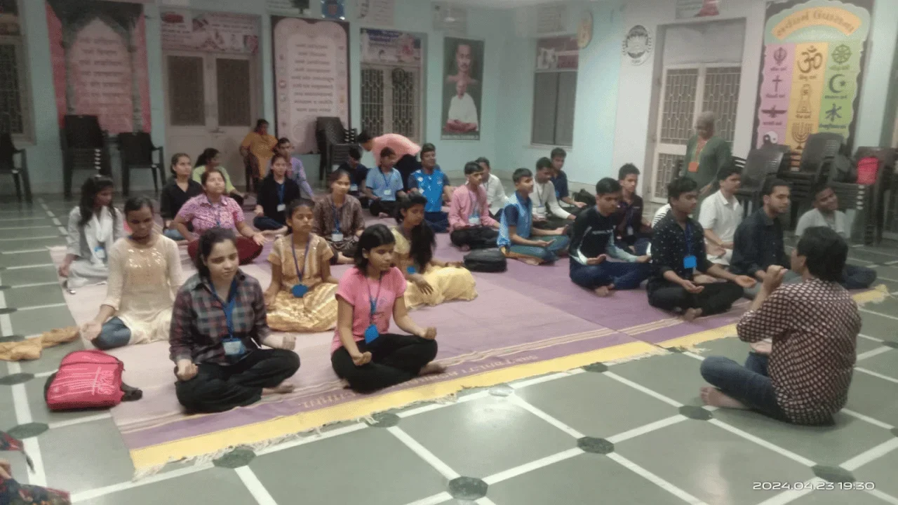 Participants seated on the floor during a group session with Snehankit Helpline volunteers.